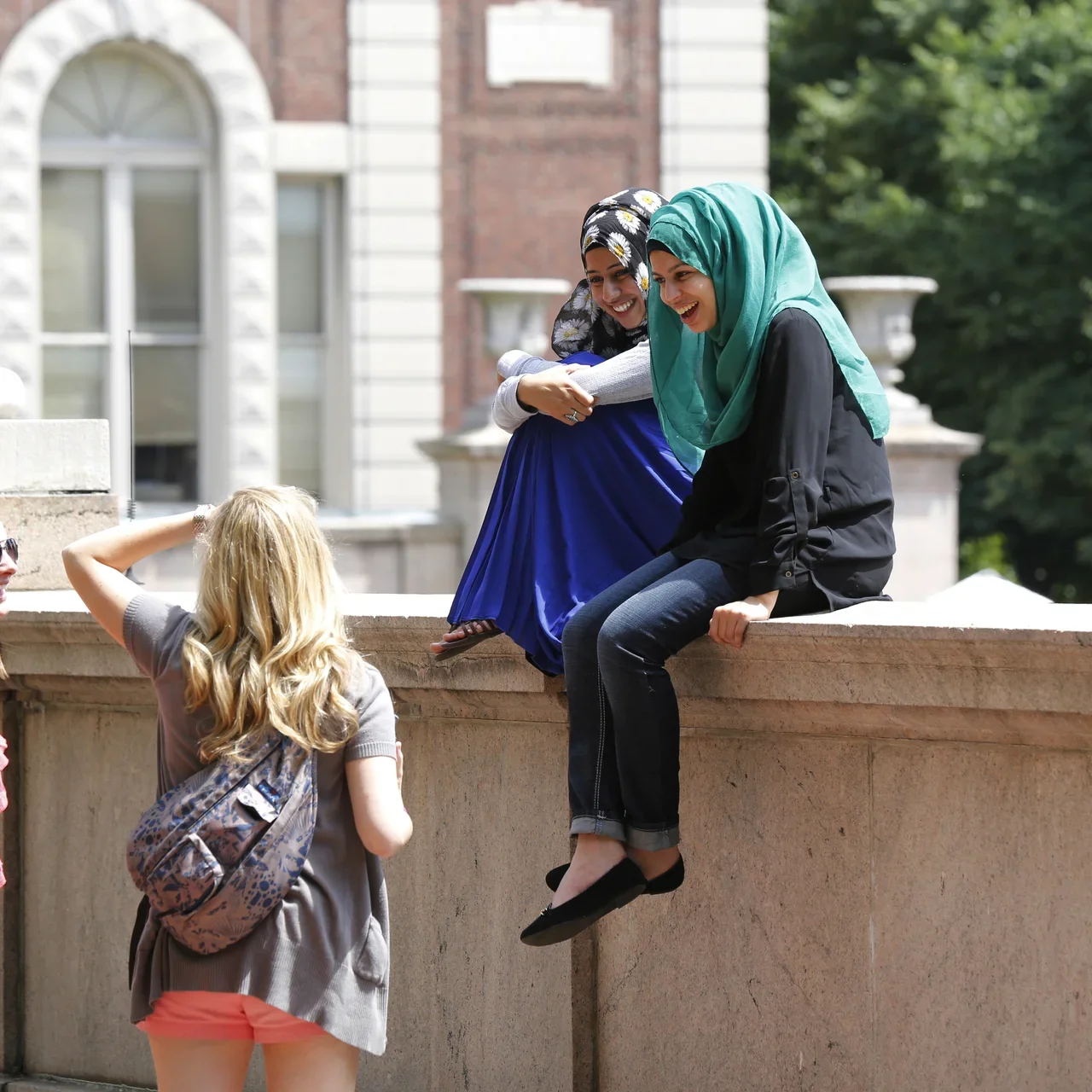 students talking on campus 