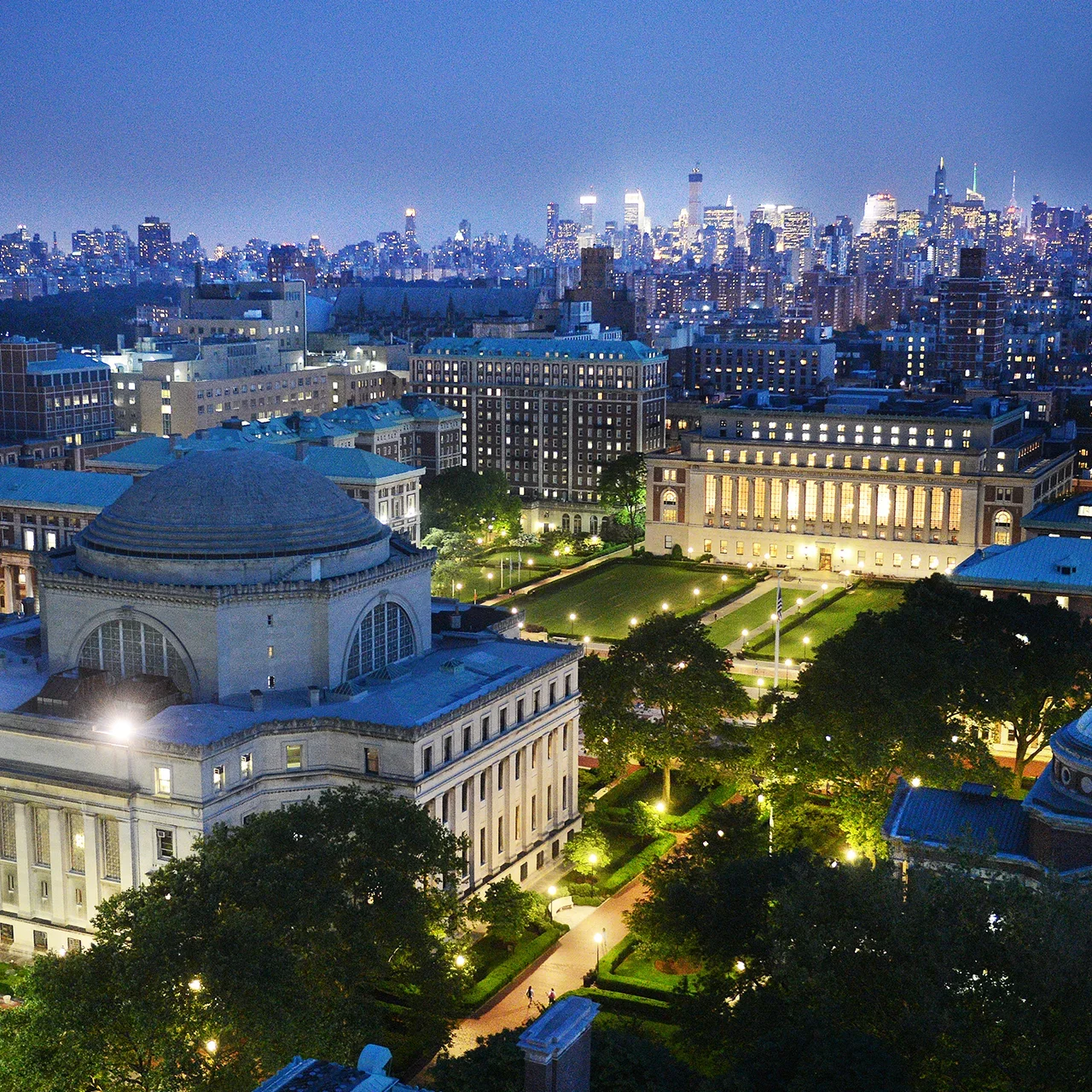 Morningside campus at night with the cityscape in the background