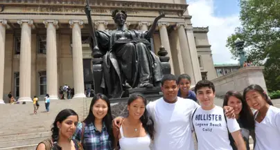 A group of students in front of Alma on the steps of Low Library.