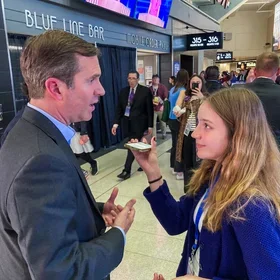  In the concourse of the United Center at the Democratic National Convention in Chicago, student reporter Clare McRoberts interviews Kentucky Governor Andy Beshear on Aug. 21, 2024, about the importance of young people participating in the election and voting. Clare is a senior and an editor-in-chief of the U-High Midway. Photo by Logan Aimone