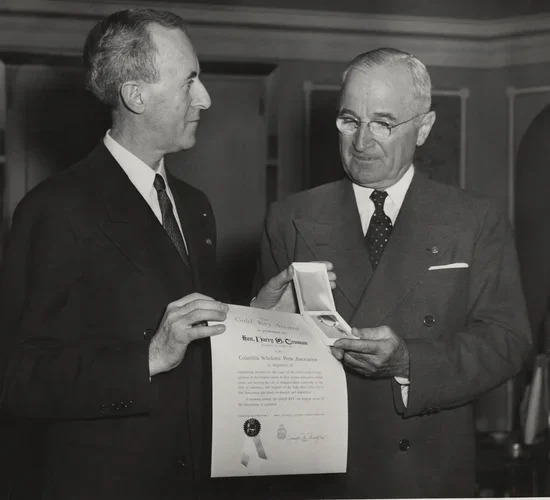 CSPA Founder and Former Director Col. Joseph M. Murphy presents former U.S. President Harry S. Truman with a CSPA Gold Key Award.